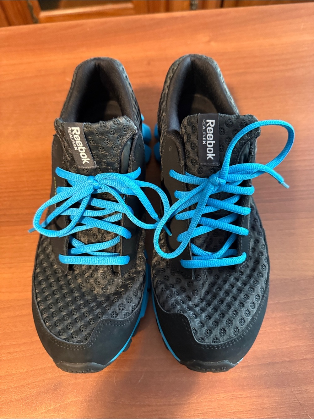 Reebok women’s Black Athletic Shoes with Bright Blue Laces